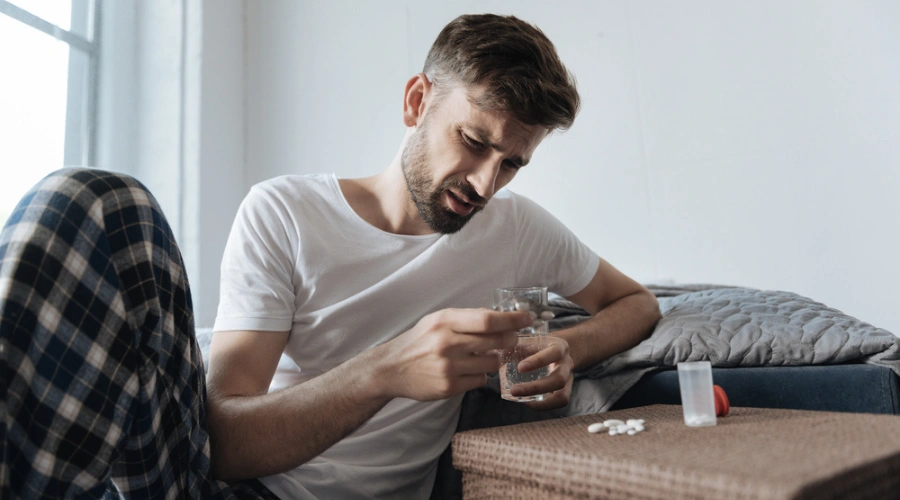 Man looking at his phone displaying how Depression And Benzodiazepines as a Dual Diagnosis - South Shores Detox