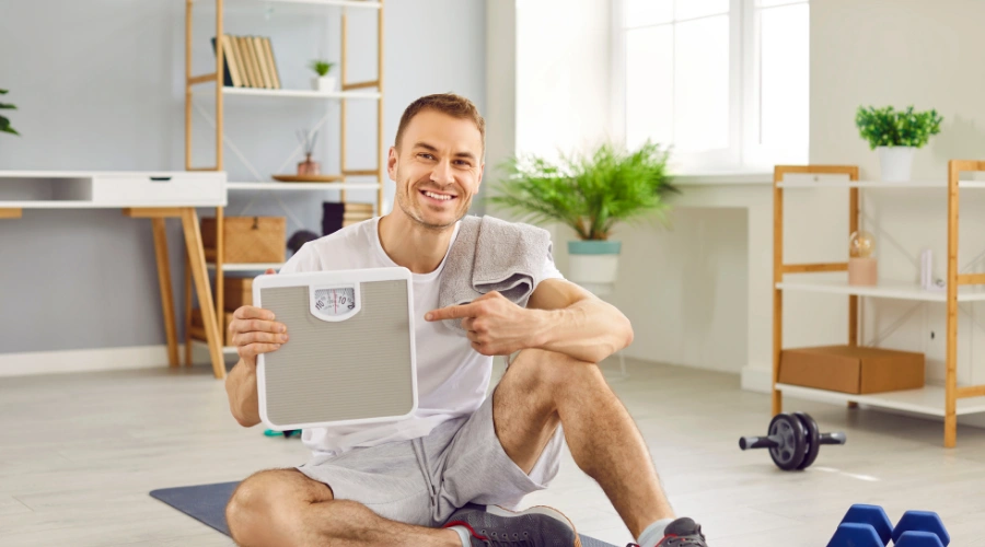 Man showing signs of weight loss and improved body health after recovering from alcohol-related liver damage