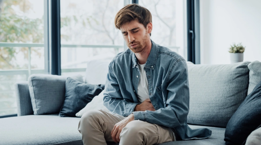 Person experiencing reduced inflammation and improved health after stopping alcohol consumption