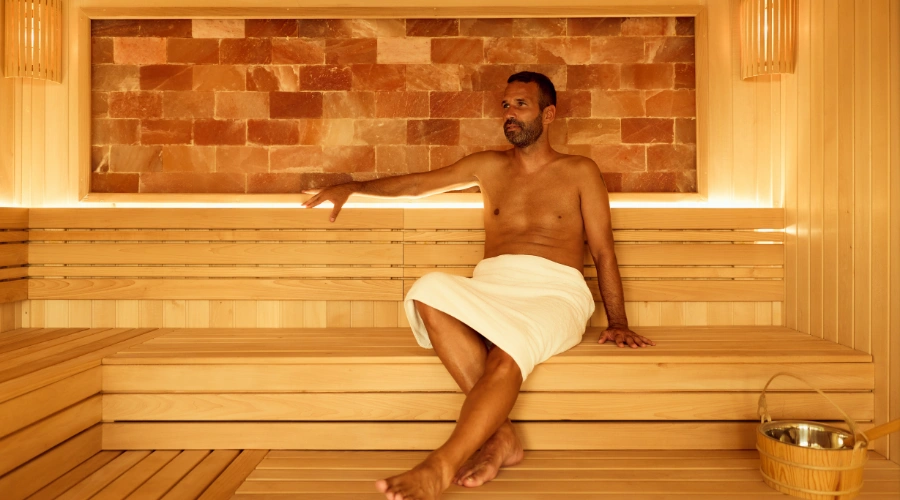 Image of a man relaxing in a sauna, displaying the benefits of Sauna Therapy for Substance Abuse