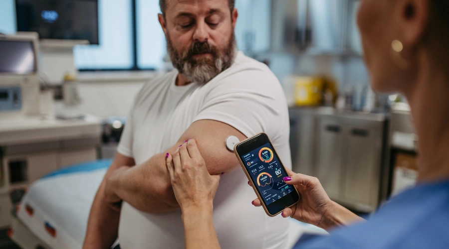 Image of a medical practitioner checking a man's glucose and sugar levels - Does Alcohol Abuse Cause Diabetes - South Shores Detox