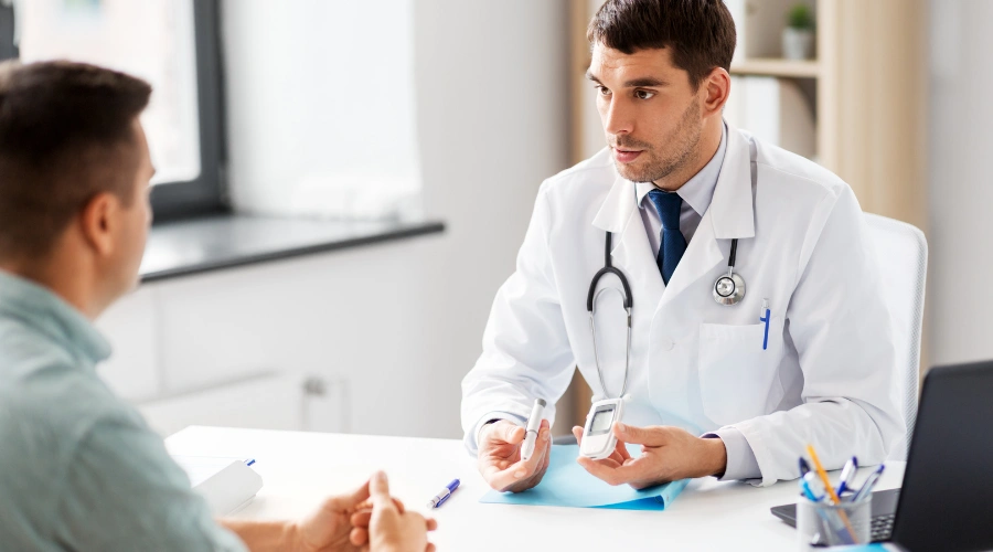 Image of  a physician discussing the glucose and sugar levels to a patient
