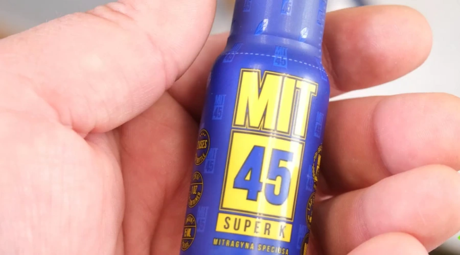 Image of a Mit 45 Shot in a man's hand - Popular Brands of 7-OH Kratom Shots