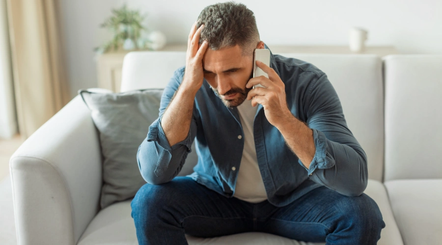 Image of a person making a confidential phone call to an addiction treatment center for help quitting kratom safely